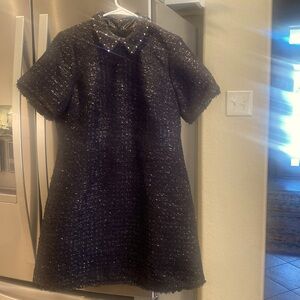 Sparkly Authentic Kate Spade black beautiful dress with fringe hemming.